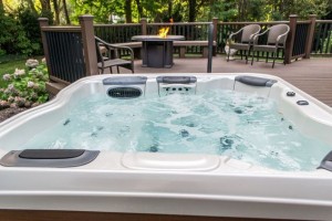Hot Tub Therapy: This client needed specific hydrotherapy advised by his doctors, and working with The Deck and Patio Company, we set the hot tub into their new deck at 18” high so the client can sit on its edge and simply swing his legs across; a sturdy handrail was also added to aid his getting in and out. The sitting area adjacent to the spa allows for easy conversation with family and friends while he is enjoying the spa’s healing waters.