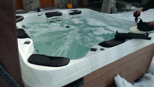 Hot Tub Winterization: Best Hot Tubs’ Tech checking filters and cleaning the skimmer