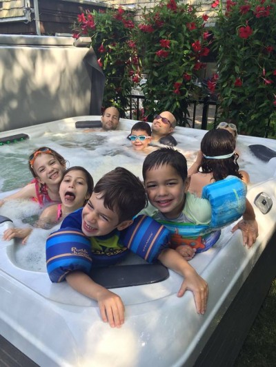 Happy Best Hot Tubs Family (Long Island/NY): A big thanks to our clients for sending us their photo. It was taken over the previous July 4th weekend. They purchased one of Bullfrog’s X models.