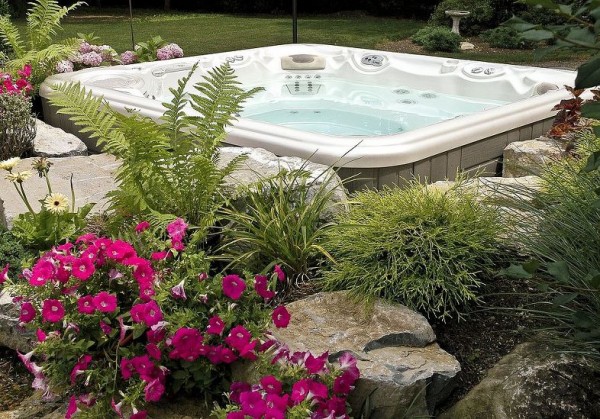 Hot Tub Set-in-Garden Installation: Here is a close up of the second project. One reason for choosing this type of custom installation is the ability to add one’s favorite flowers. In the right season, the flowers can add sweet-smelling aroma therapy to already wonderful hydrotherapy of a Bullfrog Spa.