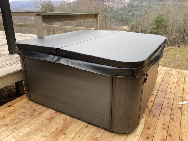 Newly expanded deck in Ashland, NY, with brand new Bullfrog Spa from Best Hot Tubs, Windham.