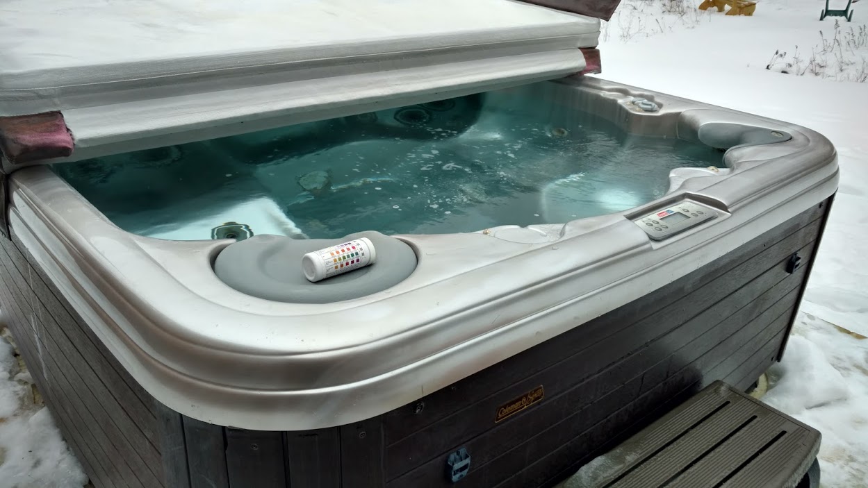Best Hot Tubs’ Tech testing spa water for: Sanitizer, pH levels, Alkalinity and Calcium