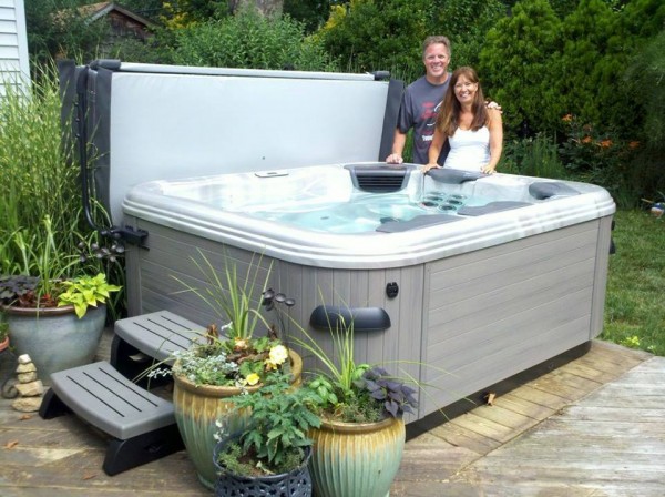 Best Hot Tubs Clients (Long Island/NY): These happy hot tub clients created an easy “set-in-garden” look with a few plant containers for their new spa. Nice, yes?