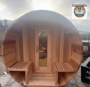 Cedar barrel shaped sauna in Tannersville NY placed to enjoy beautiful view