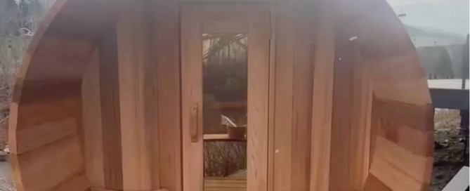 Cedar barrel shaped sauna in Tannersville NY placed to enjoy beautiful view